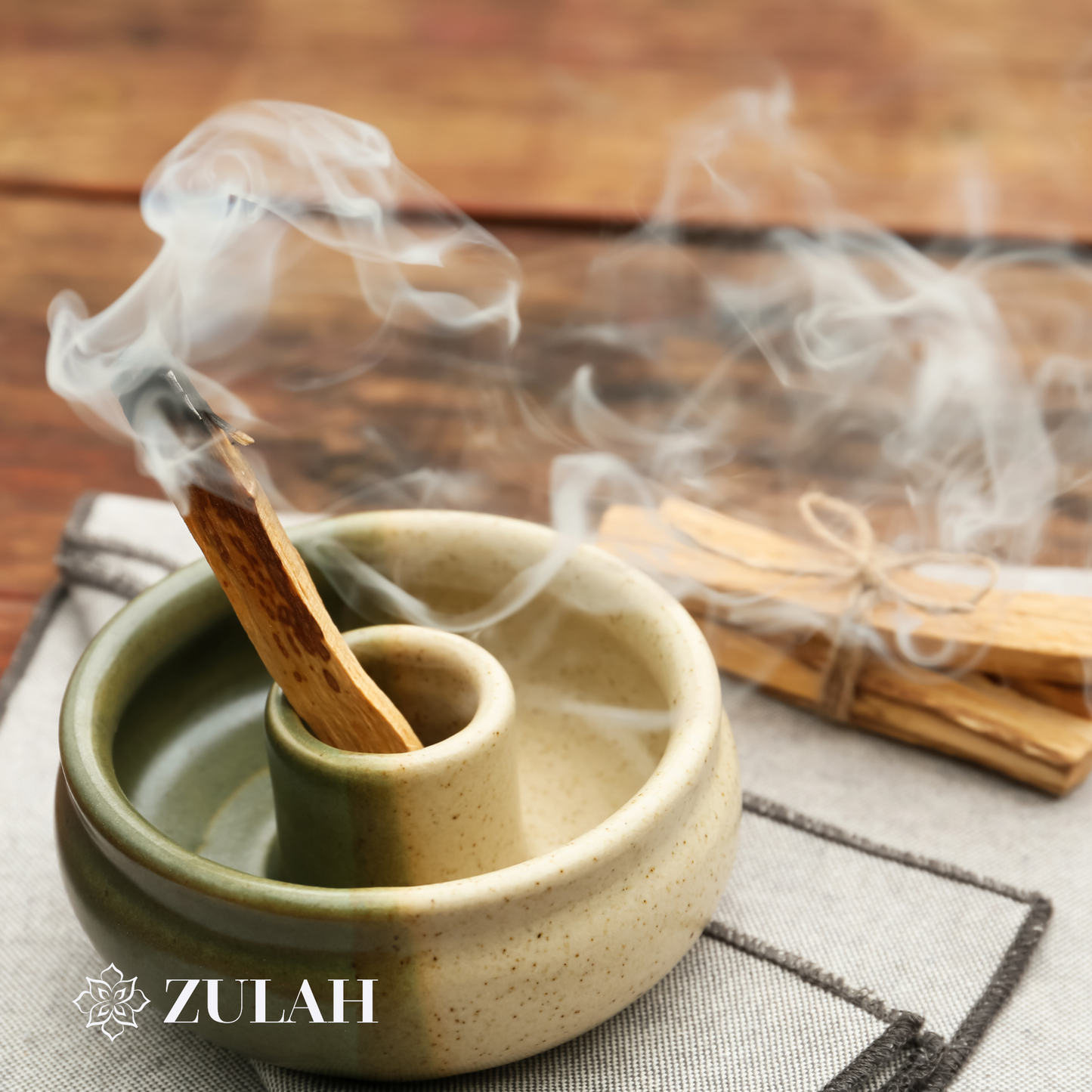 Palo Santo Stick burning in a heat-proof holder